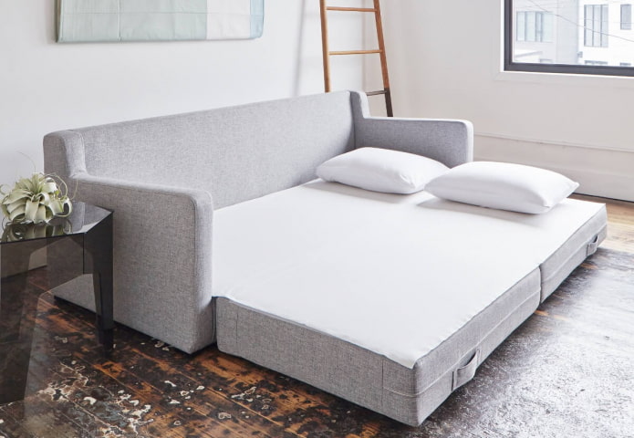 prostokątna rozkładana sofa we wnętrzu