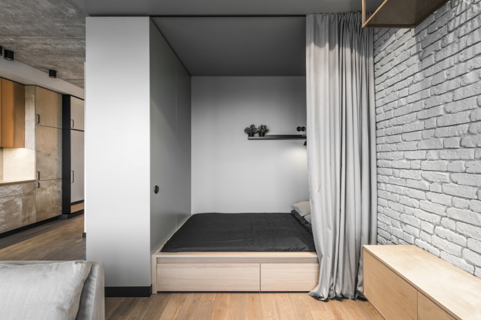nisza z łóżkiem we wnętrzu w stylu loft