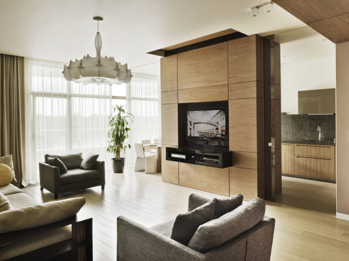 ściana z telewizorem we wnętrzu kuchni-salonu