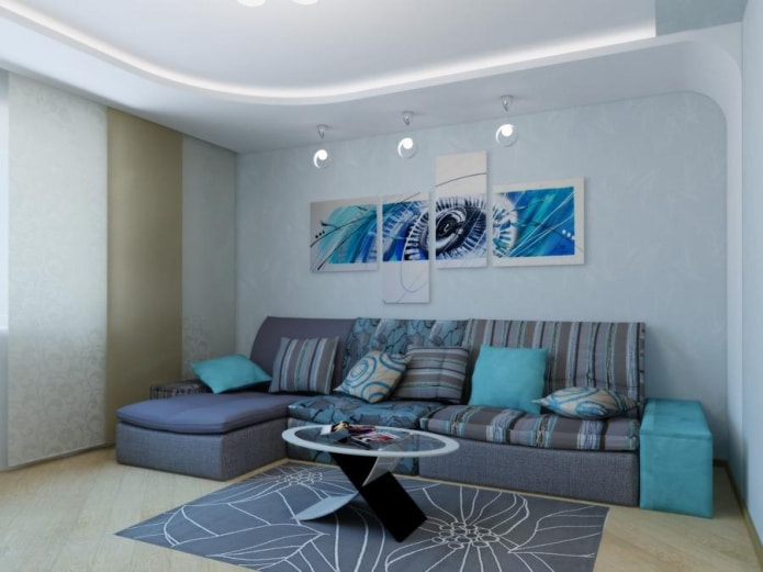 sofa z niebieskim materiałem tekstylnym i podłokietnikami